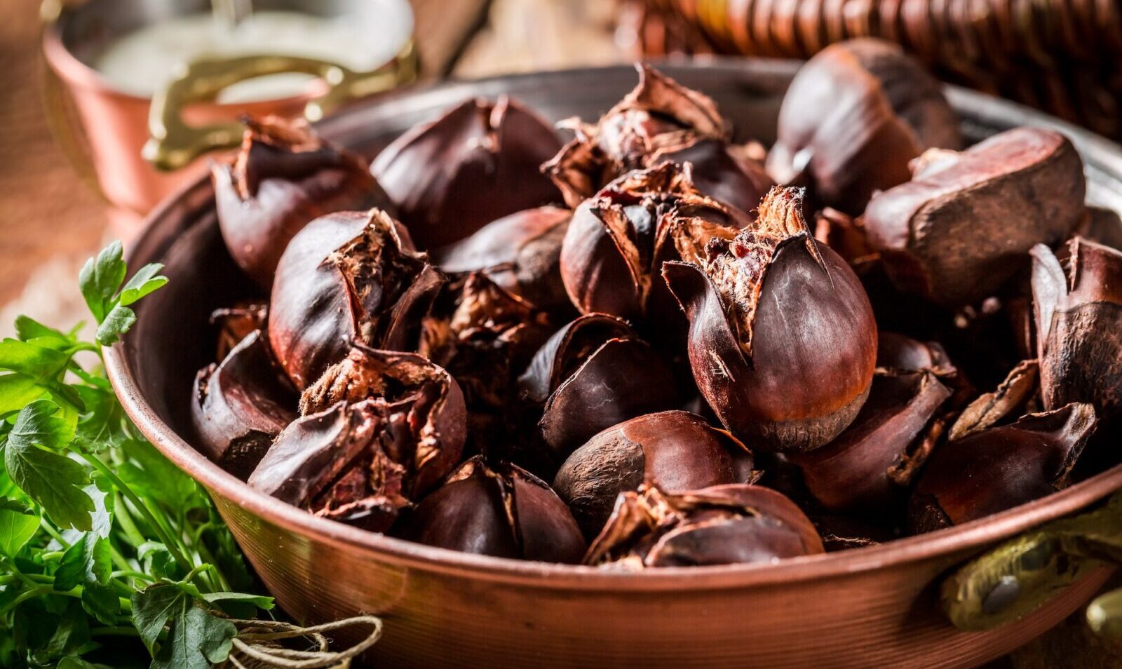 Homemade baked chestnuts on a copper pan