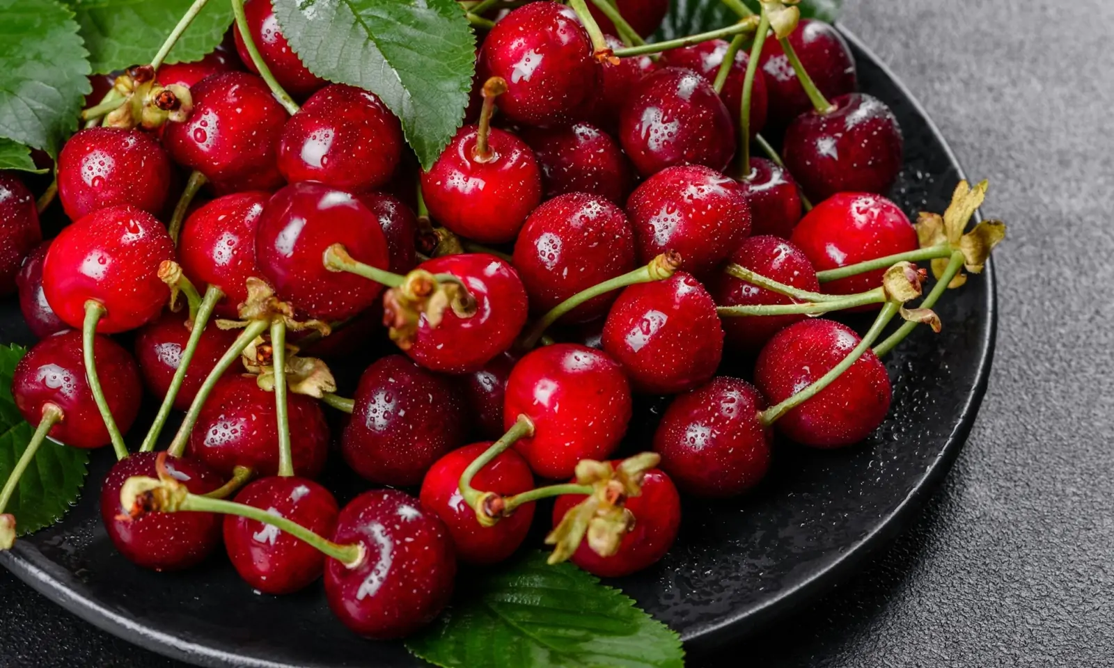 Fresh delicious red bright cherry berries torn in the summer garden