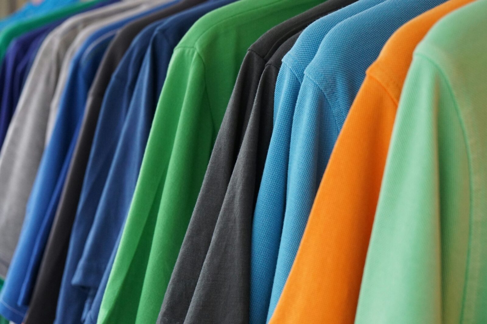 clothes rack with multicolored men's polo shirts
